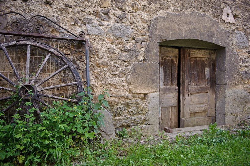 Wall old door wagon wheel by Rene du Chatenier
