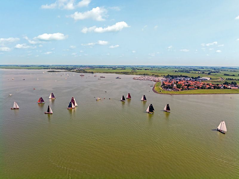 Aerial view of skutsjessilen on the IJsselmeer near Hindeloopen in Friesland Netherlands by Eye on You