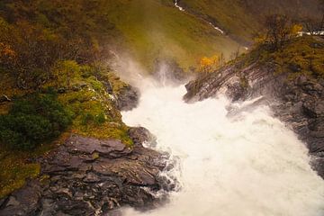 Dynamic waterfall in a rocky autumn landscape with gushing water. by Martin Köbsch