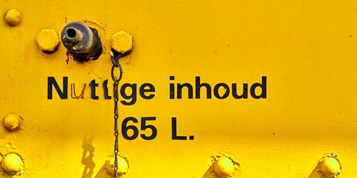 Text and valve on old yellow train