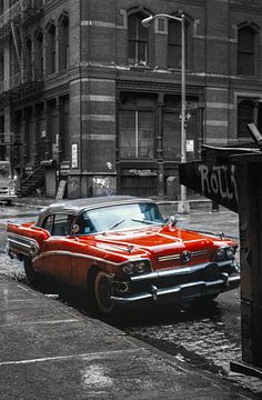 Red classic car in black and white environment New York 1980 by Albert Brunsting
