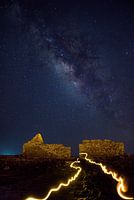The milkyway rises behind an old warehouse used to keep the marine salt