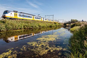 The train in the Dutch landscape: Oostzaan (reflection)