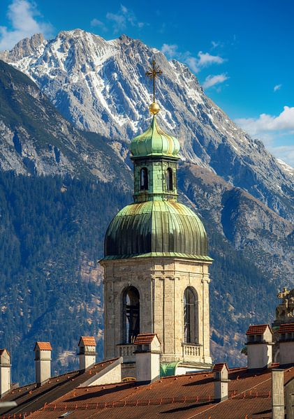 Tower of Innsbruck Cathedral in front of the mountains by ManfredFotos