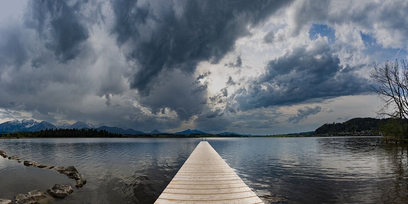 Between light and storm - a dance of the elements over Lake Hopfensee by Walter G. Allgöwer