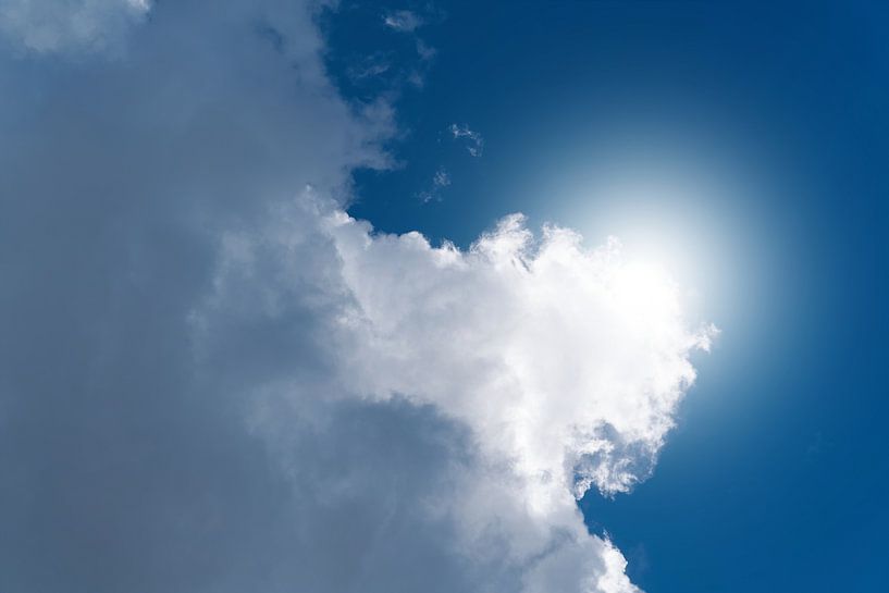 Cloud and sun on a summer day by Heiko Kueverling