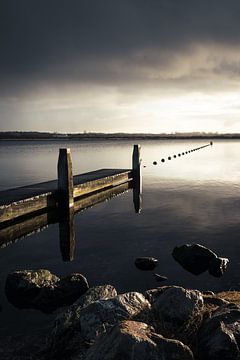 Threatening skies above the jetty at the lake of Oostvoornse by Marleen Savert