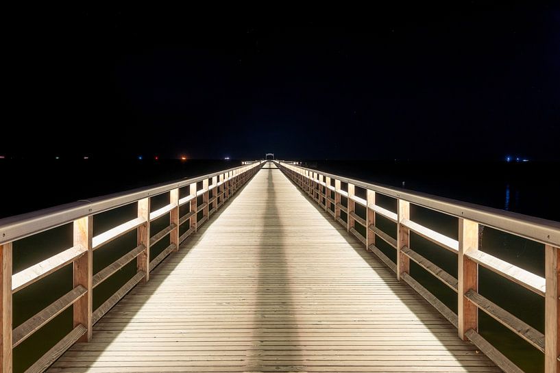 A view of the pier in Ahlbeck on the Baltic Sea at night by Andreas Völkel
