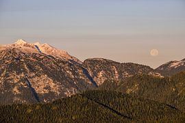 Moonset at sunrise in the bavarian alps by Christian Peters