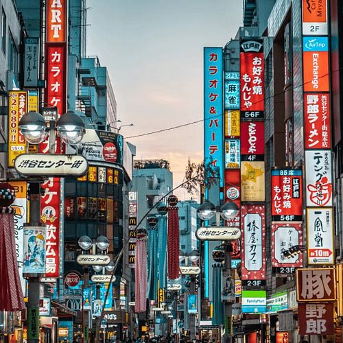 A lively urban street scene neon light