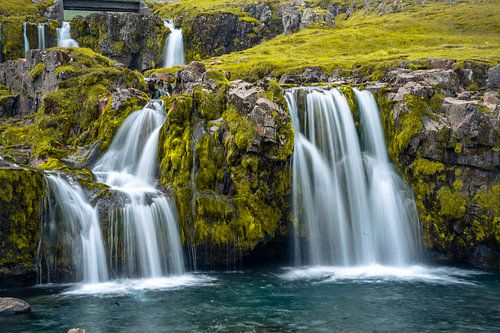 Sunset at famous Kirkjufellsfoss waterfall and Kirkjufell mounta