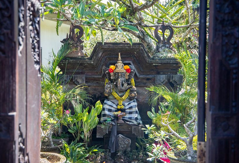 Statue in temple garden. by Floyd Angenent