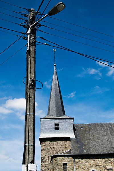 Church of Bertogne with lantern and electricity cables, Ardennes by Paul van Putten