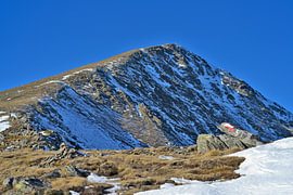 Hiking trail up to the lightly snow-covered Alpine peak of Greim. Styria, Austria by Tomherkules