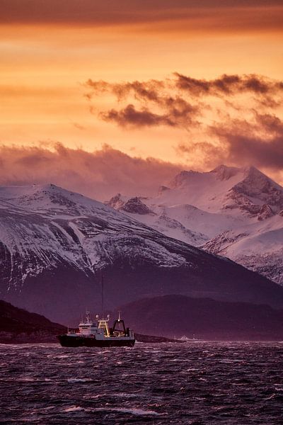 Winter landscape and sunrise with storm on Godøy, Ålesund, Norway by qtx