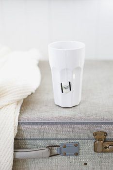 A moment of relaxation with tea in a vintage ‘ & ’ suitcase
