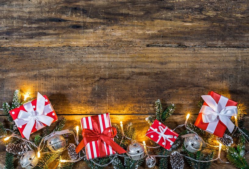 Christmas presents gifts with ornaments, green fir branches, pine cones by Alex Winter