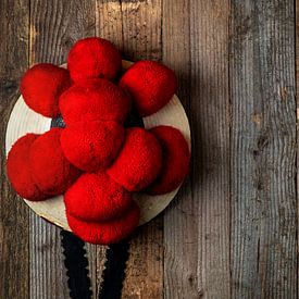 old Bollen hat in front of wooden wall by Jürgen Wiesler