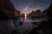 Dark clouds over a sunrise in Lagos, Portugal