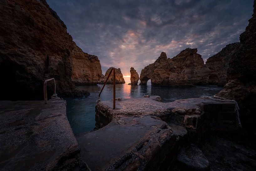 Dark clouds over a sunrise in Lagos, Portugal by Rudolfo Dalamicio