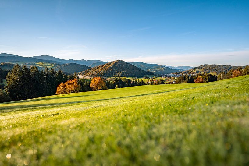 First rays of sunshine in autumn with a view of the Hochgrat, Staufen and Oberstaufen by Leo Schindzielorz