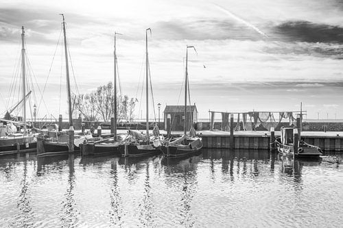 West harbour Urk with fishing nets in black and white