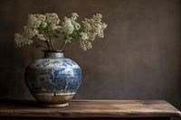 Still life blue vase with white flowers