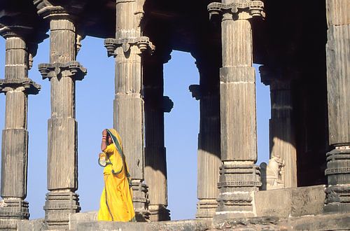 Woman in yellow for temple.