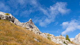 Nature of Italy – South Tyrol – The rugged Rosengarten massif above autumnal alpine meadows by Sebastian Czech