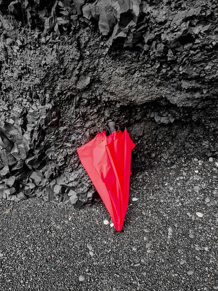 Red umbrella on volcanic basalt rocks in Iceland by MPfoto71