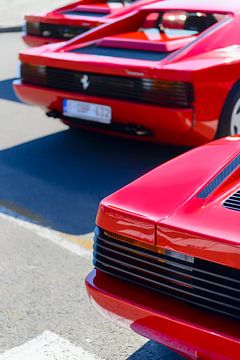 Three red Ferrari Testarossa 1980s sports cars
