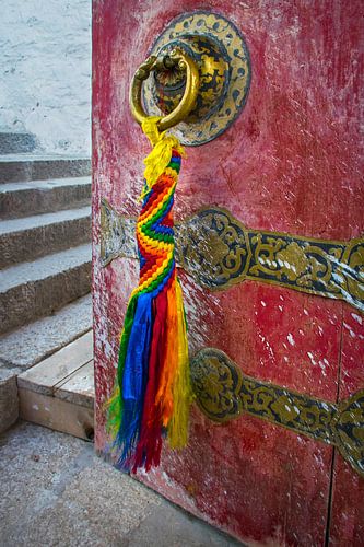 The door is ajar in a monastery Tibet