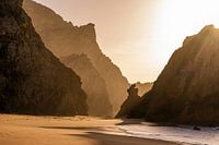 Rock silhouettes on the beach.