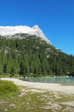 The turquoise-coloured Lake Sorapis is nestled in the dramatic rocky backdrop of the Dolomites and looks like a magical place from another world - wild, clear and breathtakingly beautiful. by Miriam Schwarzfischer Fotografie