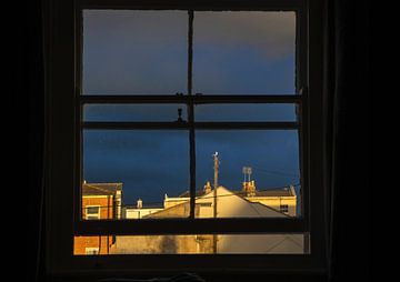 Sunset in a town in England seen through a window. Edward Hopper style. by Albert Brunsting