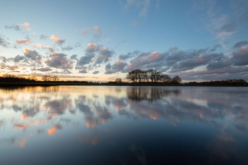 A beautiful sunset over a fen with reflections above the water it by KB Design & Photography (Karen Brouwer)
