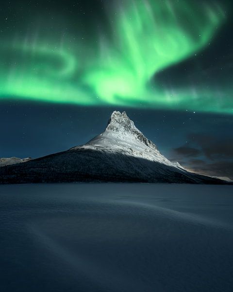 The Land of Always Winter – Northern Lights Over Snowy Mountain by Daniel Laan