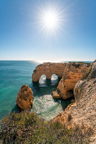 Natural stone arches near Praia da Marinha beach by Leo Schindzielorz