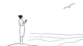 Woman with smartphone on the beach by Frank Heinz