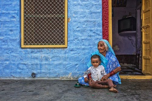 Portrait of an old Indian woman in colourful ethnic clothing with her grandson. Jaisalmer, Rajasthan