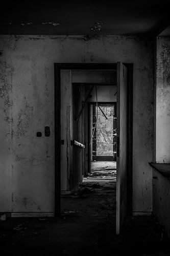 Black and white dilapidated aisle by Sasja van der Grinten