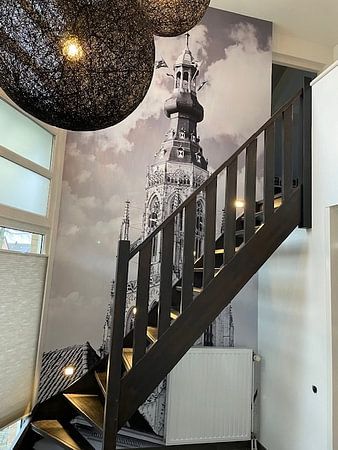 Ornate church tower against cloudy sky