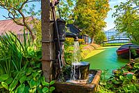 The painting of the old-fashioned water pump