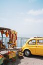 Vintage yellow fiat 500 in the Amalfi Coast by Liz Schoonenberg thumbnail