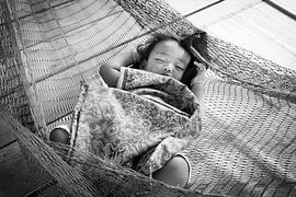 Thai girl in hammock. by Aukelien Philips