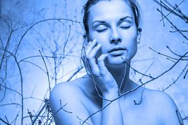 sensual woman between branches by Jörg B. Schubert