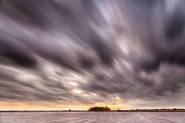 Dark clouds drifting over a lake in Groningen by Evert Jan Luchies