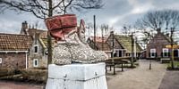 Boots on a bollard in the village of PaesensModdergat in Friesland. by Harrie Muis thumbnail