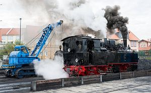 crane loading coal into steam loc