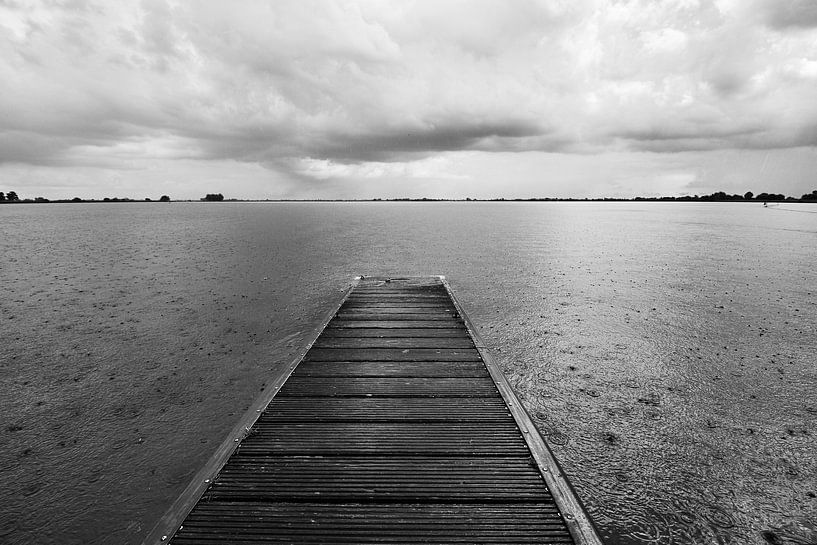 Dark rain clouds migrate across the lake by Jolene van den Berg
